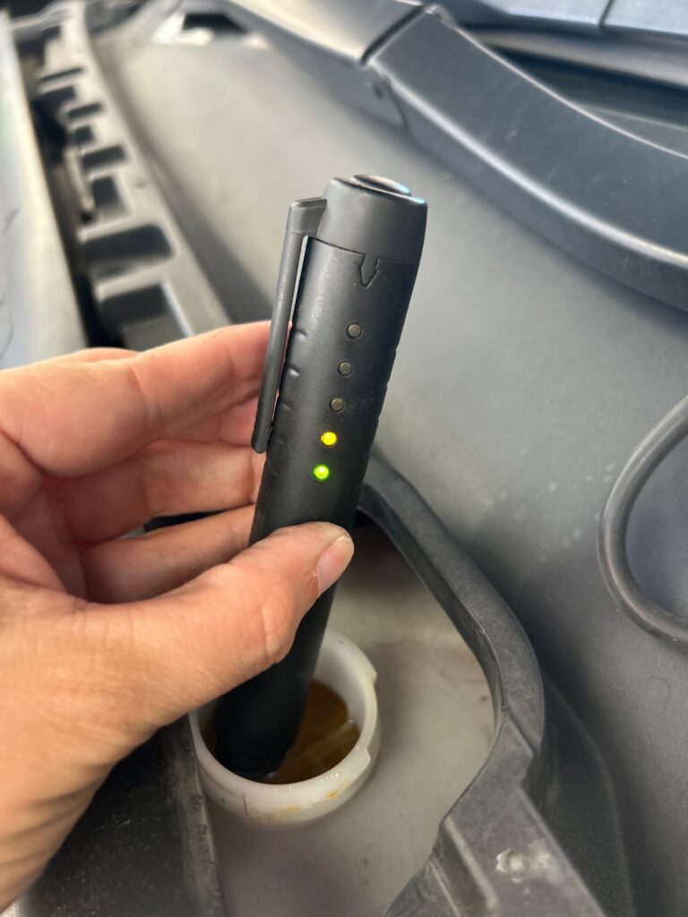 Brake fluid condition testing during preventative maintenance service at Chimney Rock Car Care in Houston, TX
