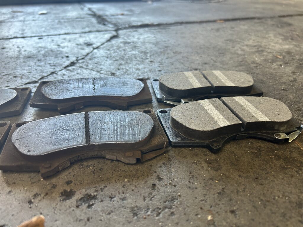 New and worn front brake pads on Toyota 4Runner in Houston