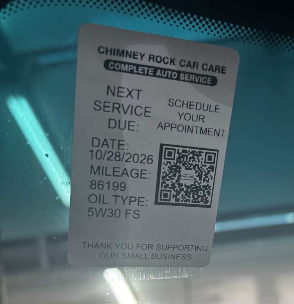 vehicle maintenance reminder sticker at Chimney Rock Car Care in Houston